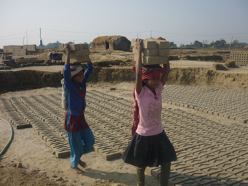 Girls working in brick factory in Nepal.