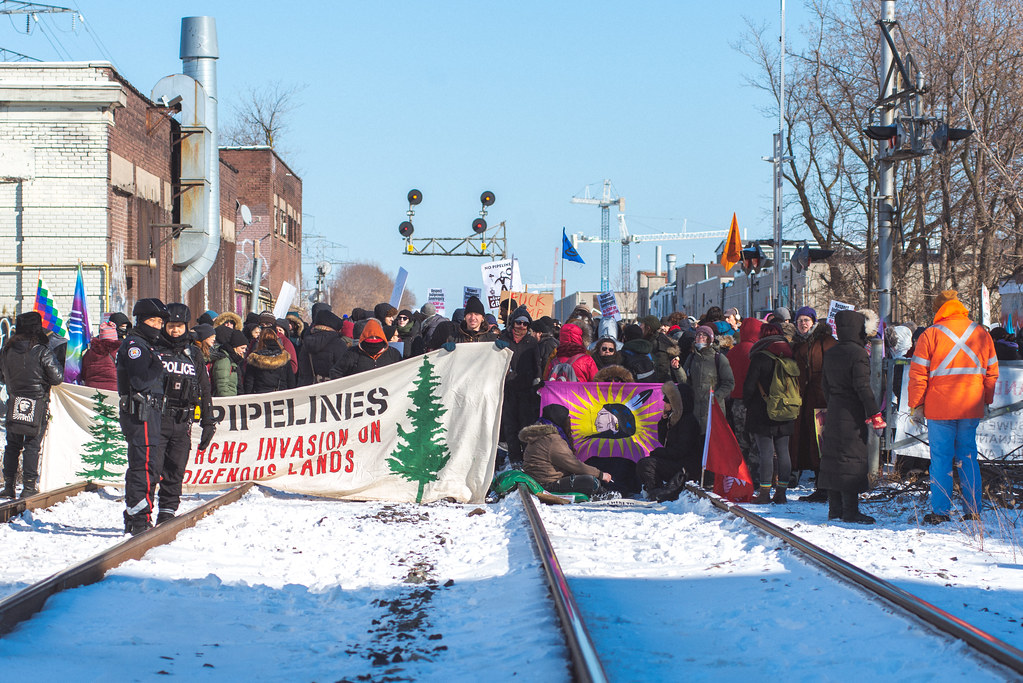 group of protestors looking east with sun good light - Wet'suwet'en Solidarity Event - Toronto Train Stopped at Dufferin Street and Bartlett Avenue in Toronto - Saturday, February 8, 2020