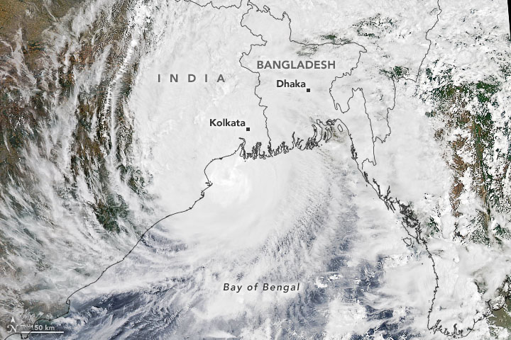 Satellite image of Cyclone Amphan with a map of India and Bangladesh laid over it.