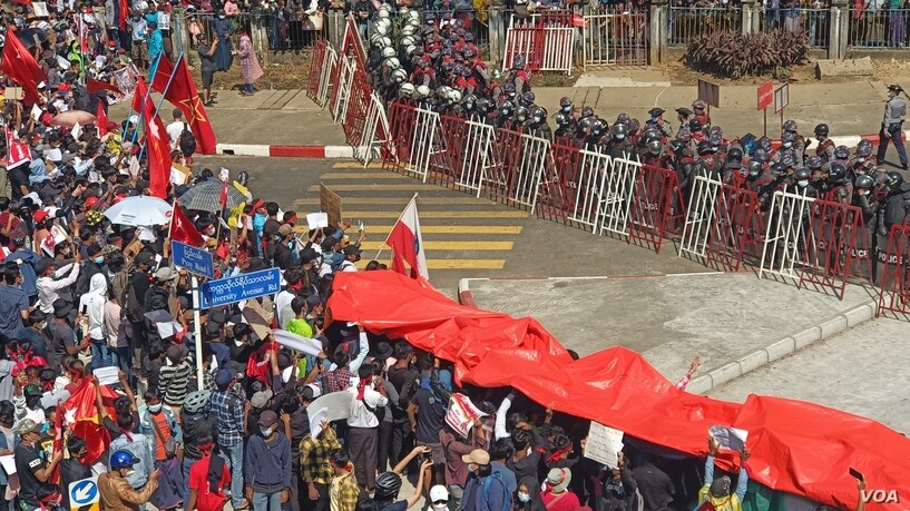 Protesters rally against the military coup in Yangon, Myanmar, Feb. 9, 2021.