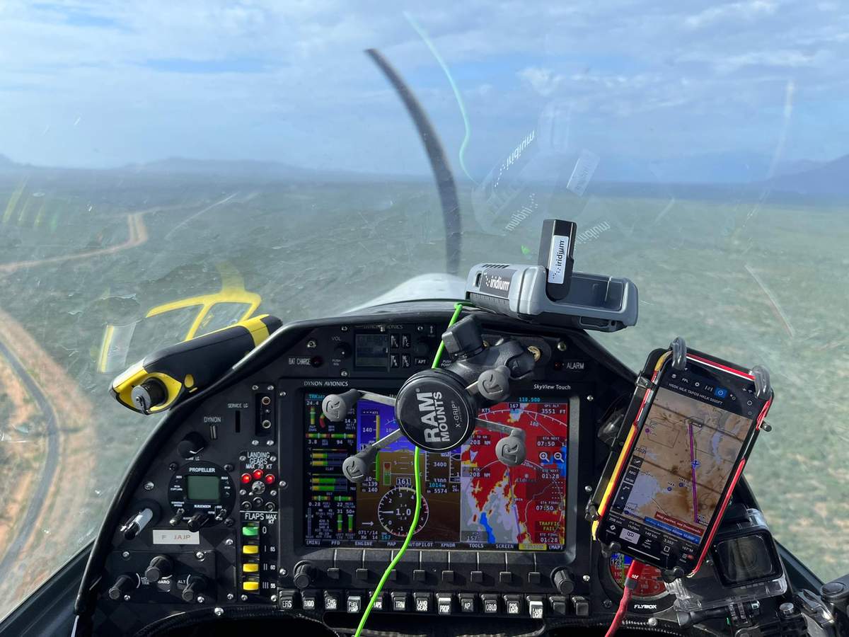 A view of the control panel of the microlight airplane, along with a phone and other gadgets, as the Mack flies over Kenya.