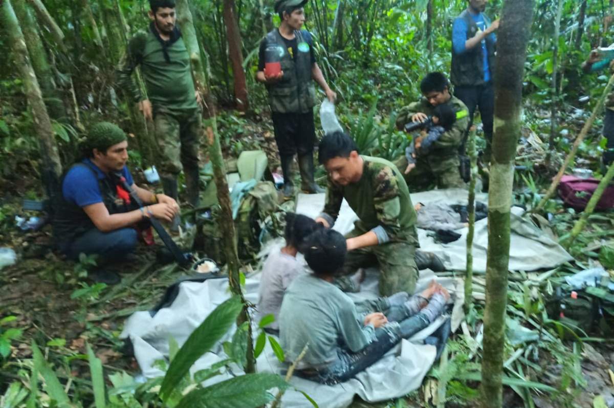 Colombian soldiers and volunteers help the children who have been on their own in the rainforest for the last 40 days.