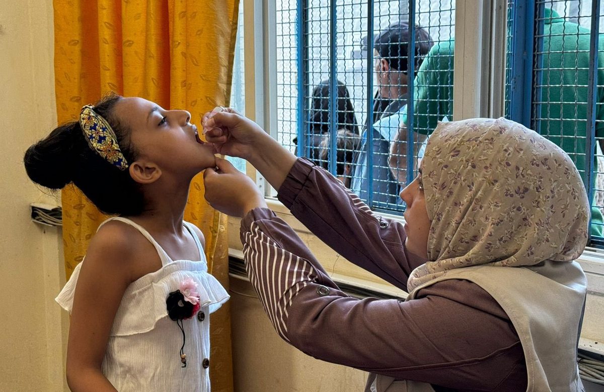 A young girl gets a polio vaccine as part of the large vaccination effort in Gaza.