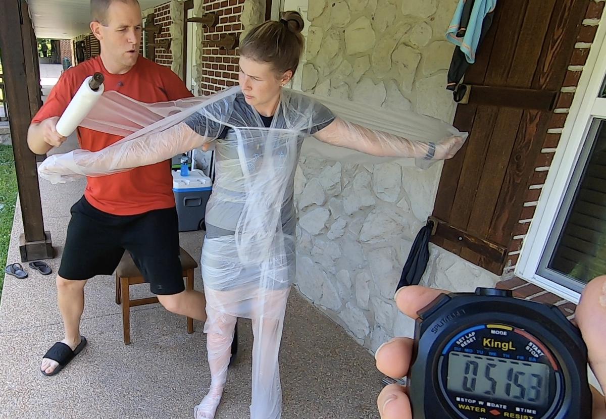 David Rush's wife helps him set the world record for the fastest time to cover someone in plastic wrap.