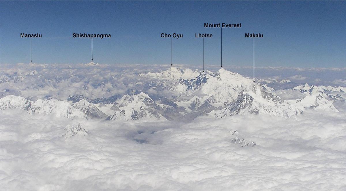 An aerial view from a flight over Himalaya to Lhasa, Khumbu region. Six 8,000ers are visible: Makalu, Everest, Lhotse, Cho Oyu, Shishapangma, and Manaslu.